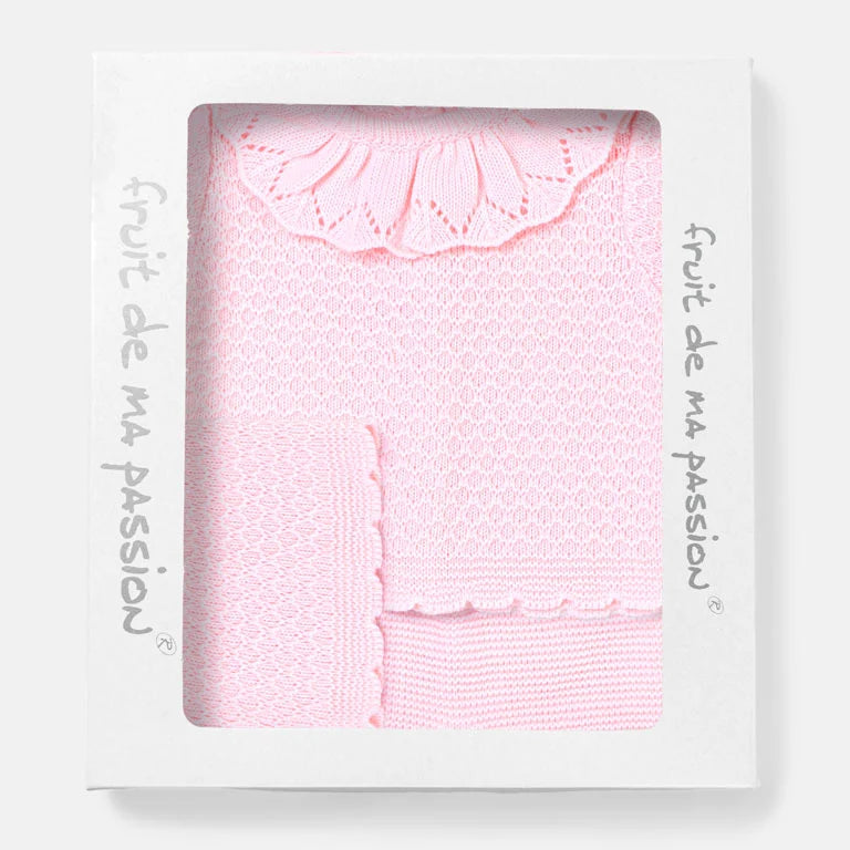 A light pink knitted baby set with a scalloped lace border, presented inside a white window box package with 'fruit de ma passion' printed on the side. AdoraBaby.co.uk