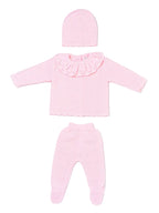 A three-piece Fruit de ma Passion baby knit outfit set in light pink, including a long-sleeve top with a ruffled collar, matching footed pants, and a knit bonnet, AdoraBaby.co.uk