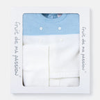 A baby knit sweater in light blue and white, presented inside a white gift box with a clear window. The box has the brand name 'fruit de ma passion' printed vertically on the sides.