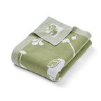 Green baby blanket with white golf patterns on a white background