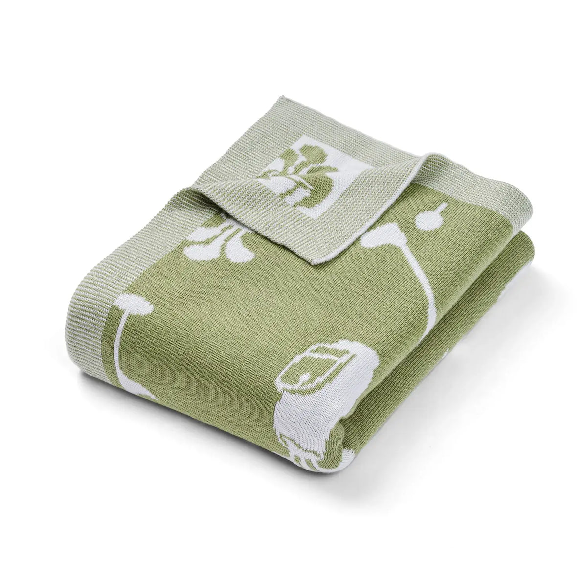 Green baby blanket with white golf patterns on a white background