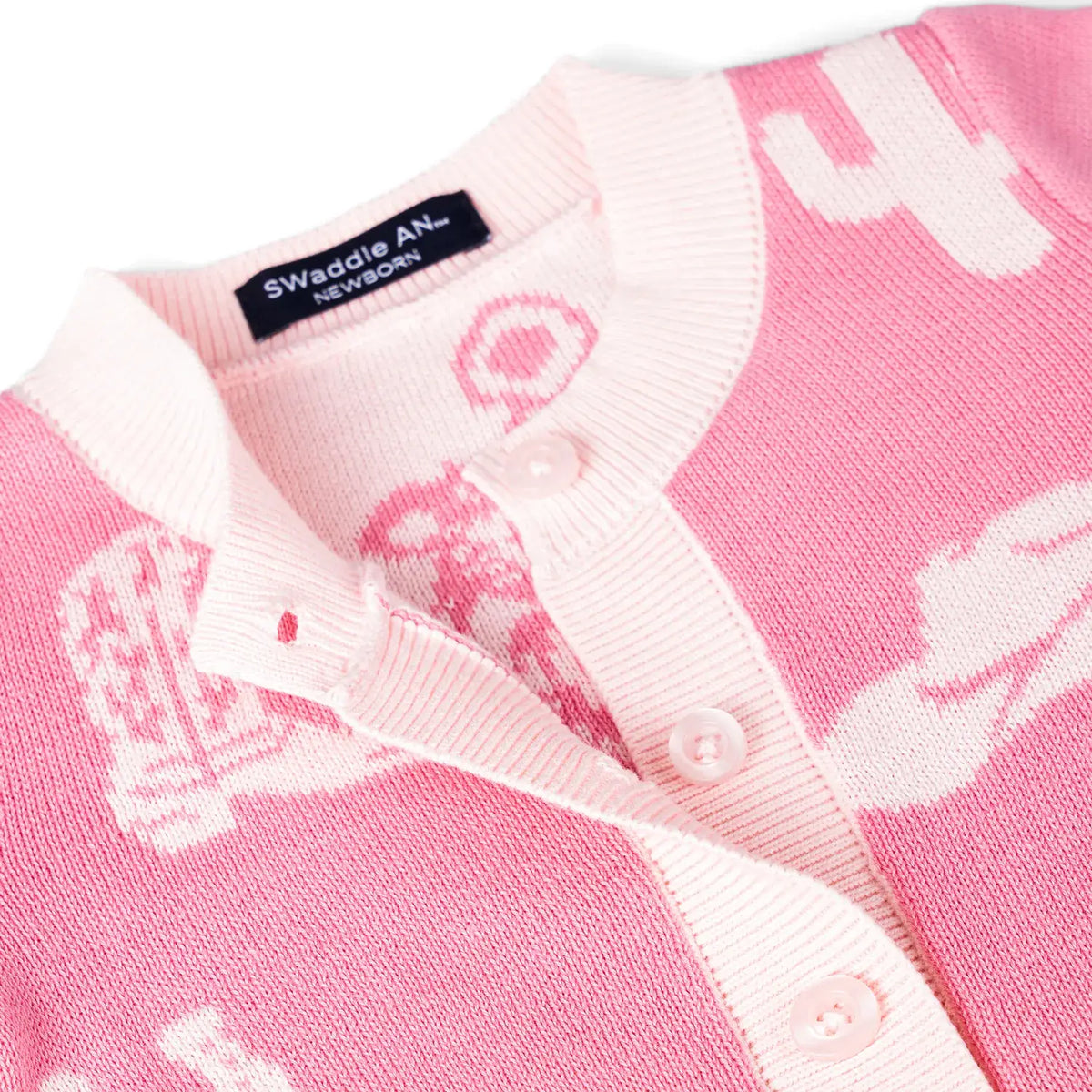 Close-up of a pink and white cowgirl boot knit baby romper  AdoraBaby.co.uk.
