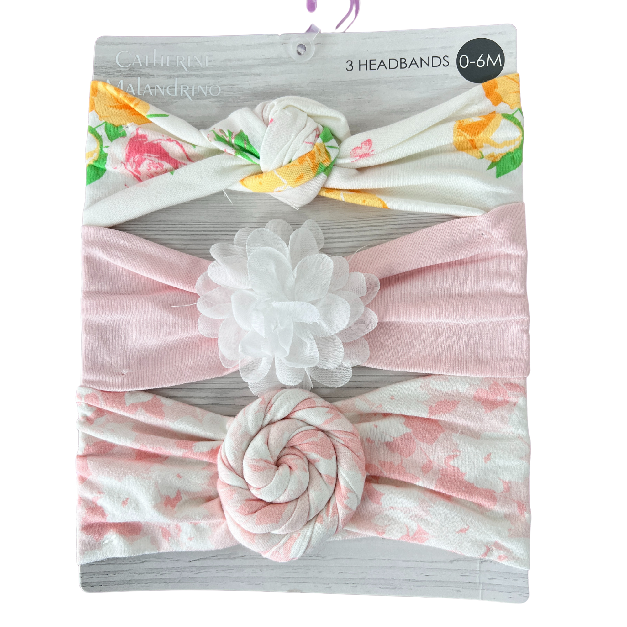 Packaged baby headbands with floral designs on a white background Adorababy.co.uk