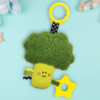 Toy broccoli with a yellow base and smiley face on a light blue background