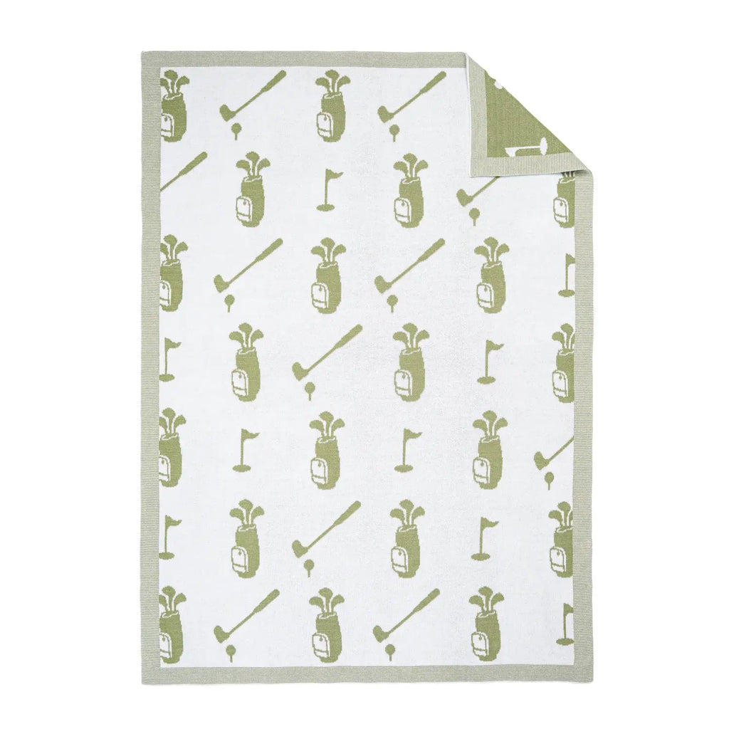 Golf-themed baby blanket with patterns of golf bags, clubs, and flags on a white background