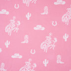Pink Baby Girls Western Blanket | Cowgirl & Country Design | AdoraBaby Pink fabric with a white western-themed print featuring cacti, cowboy and rider motifs, horseshoes, and cowboy boots.
