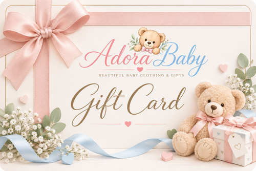 A decorative gift card for Adora Baby, shown with a large pink ribbon bow, teddy bear illustration, baby clothing and gifts text, flowers, and a plush teddy bear holding a wrapped present on a soft pastel background.