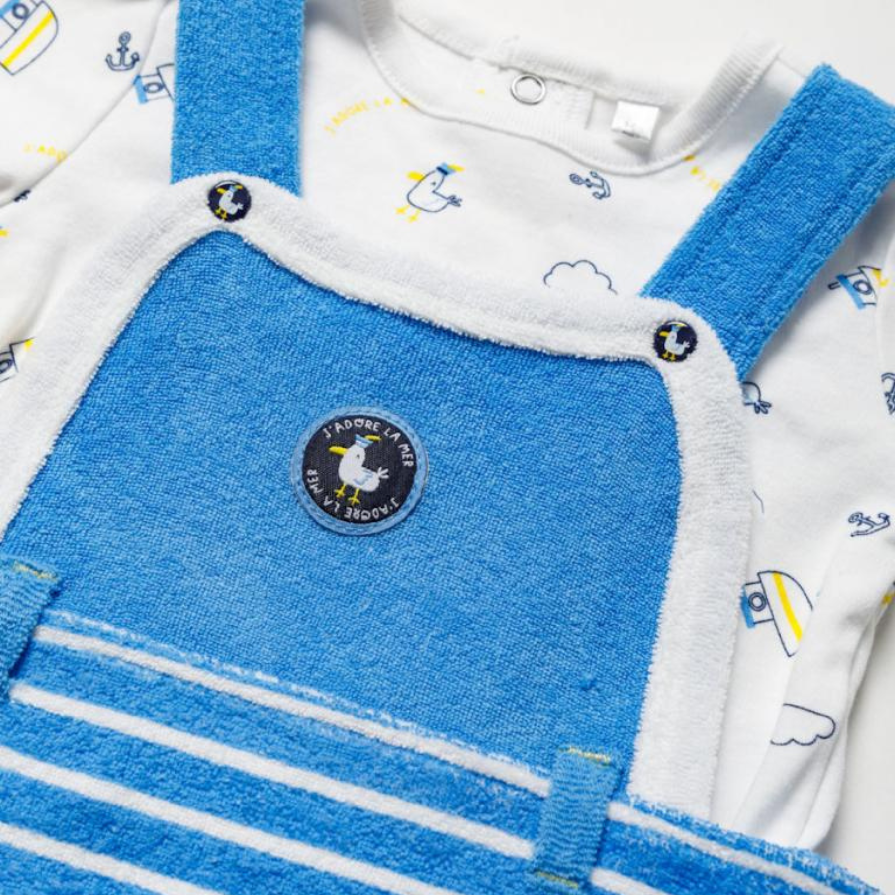 Blue baby overalls with a logo on a white background | Adorababy