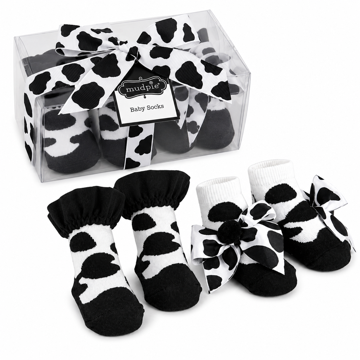 Cow print baby socks with a clear packaging box on a white |background | AdoraBaby.co.uk