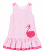 Pink dress with flamingo design on a white background | Adorababyco.uk