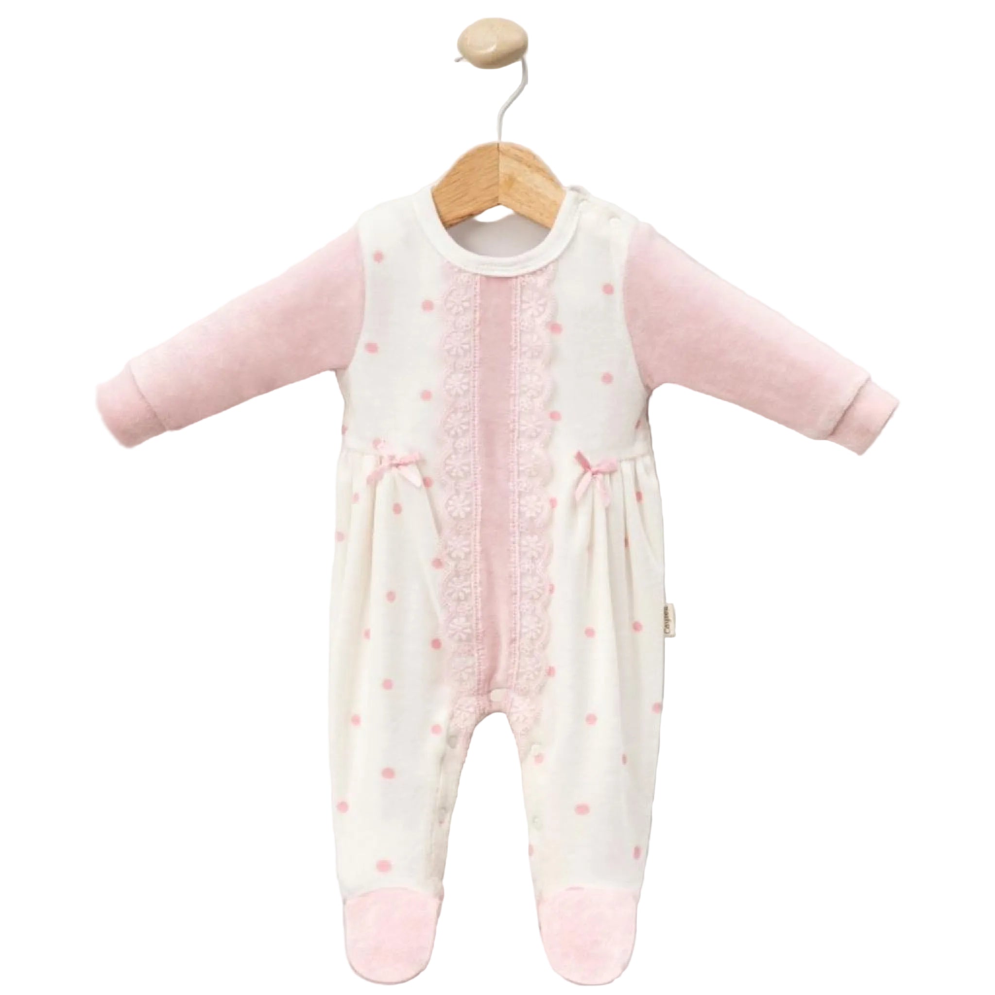 Baby onesie with pink dots & lace on a wooden hanger against a white background