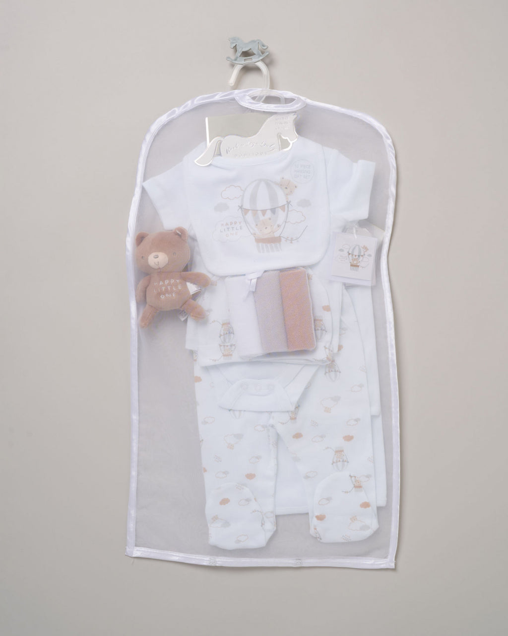 Baby clothing set with a teddy bear in a clear bag on a gray background - Adorababy.co.uk