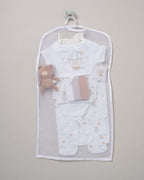 Baby clothing set with a teddy bear in a clear bag on a gray background - Adorababy.co.uk