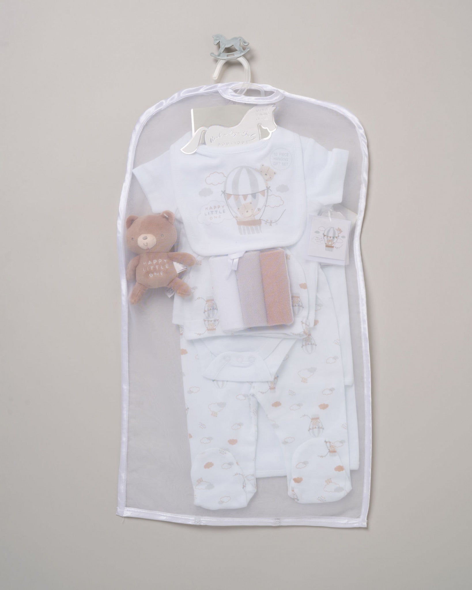 Baby clothing set with a teddy bear in a clear bag on a gray background - Adorababy.co.uk
