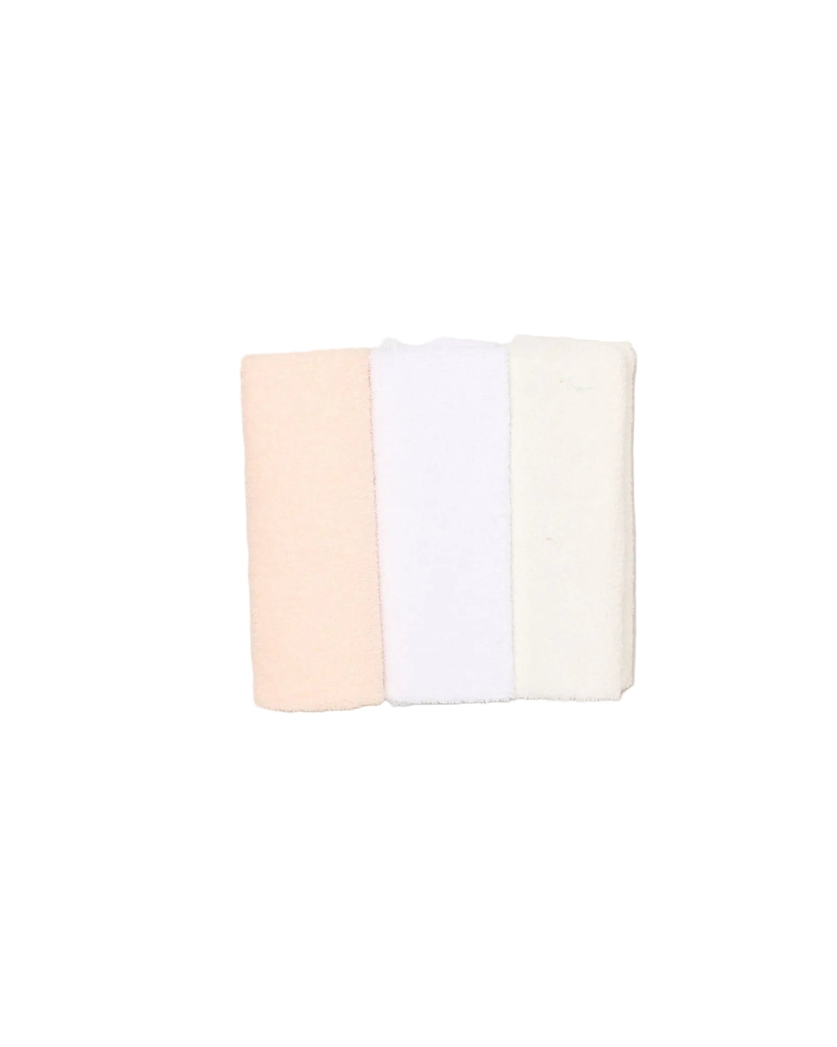 Three folded towels in beige, white, and pink on a light beige background