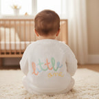 Baby wearing white cotton 'little one' applique baby cardigan - Adorababy.co.uk