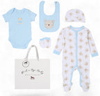 Baby clothing set with onesie, bib, hat, and diaper bag from Rock a Bye Baby Boutique on a white background. Baby Bear 5 Piece Newborn Gift Set in Sky Blue | Baby Boy Gift Set | Adorababy.co.uk