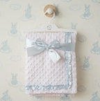 white dimpled baby blanket with sky blue satin trim - adorababy.co.uk