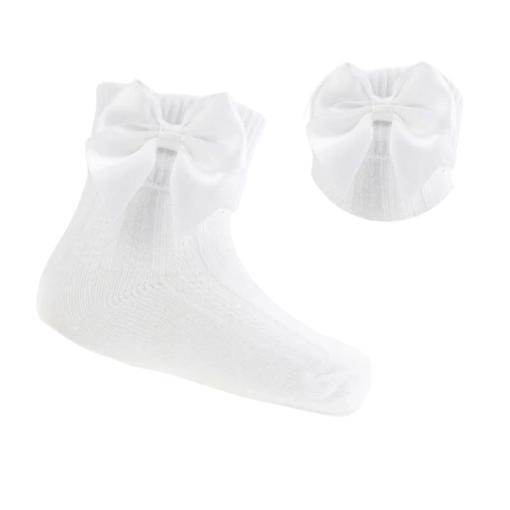 White baby socks with a bow on a white background - Adorababy.co.uk