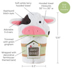 Hooded towel shaped like a cow with text labels and dimensions on a white background