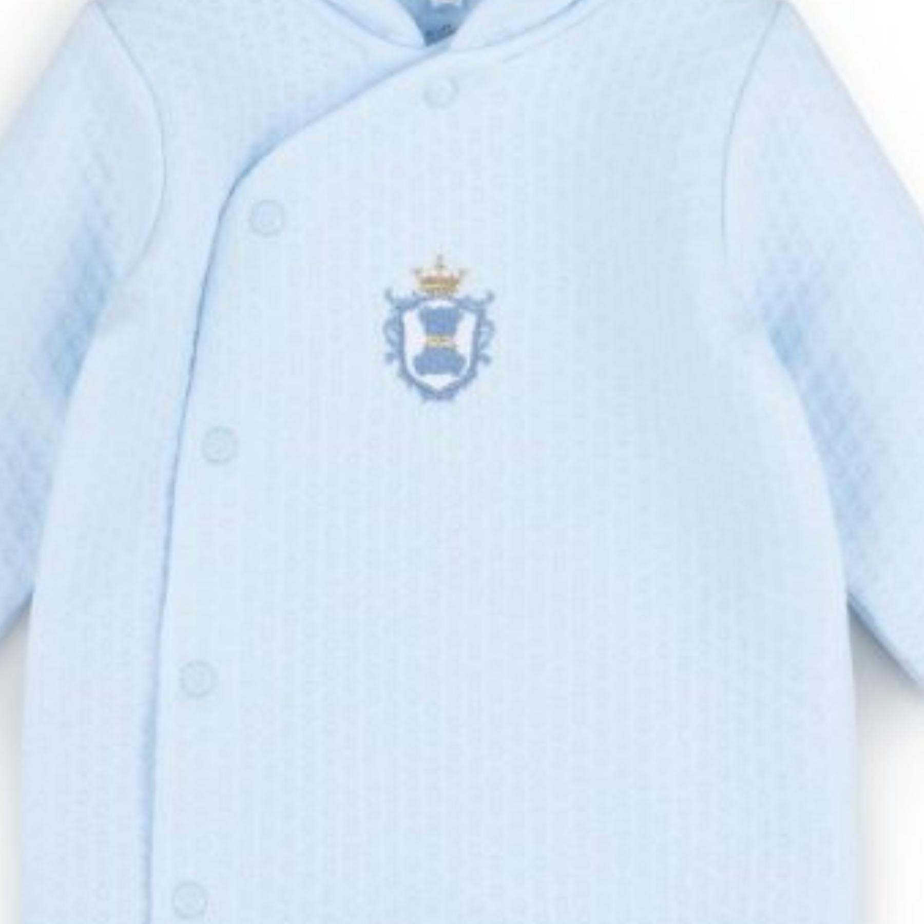 Light blue baby outfit with a small emblem on a white background | Adorababy.co.uk
