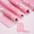 Pink Baby Girls Western Blanket | Cowgirl & Country Design | AdoraBaby Close-up of pink fabric with white embroidery and a pink boot design.
