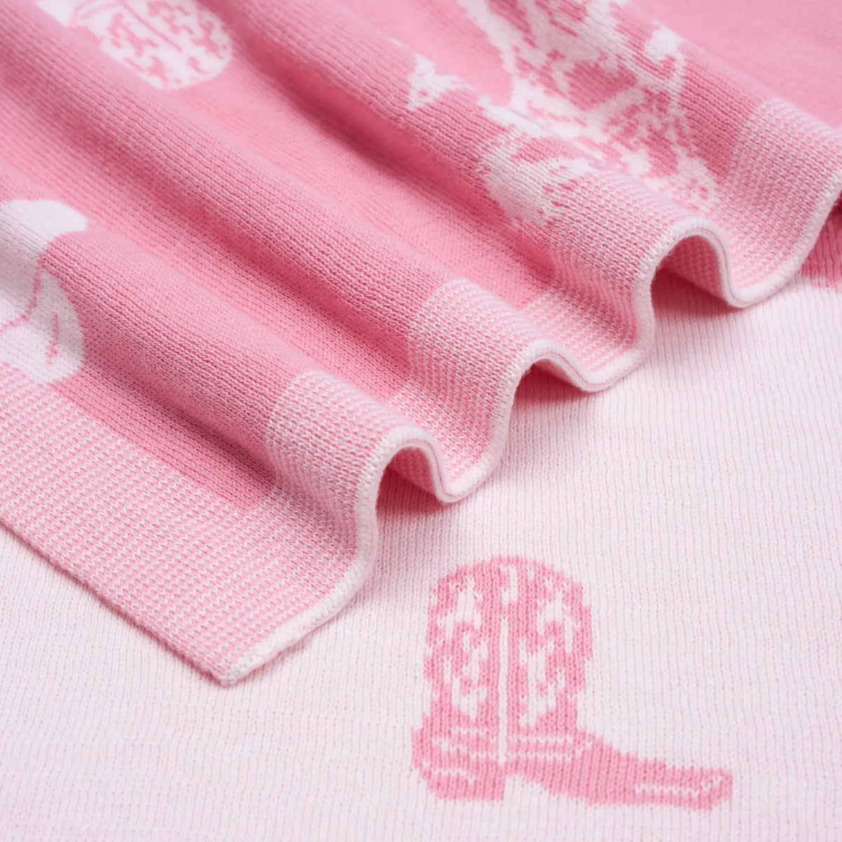 Pink Baby Girls Western Blanket | Cowgirl & Country Design | AdoraBaby Close-up of pink fabric with white embroidery and a pink boot design.