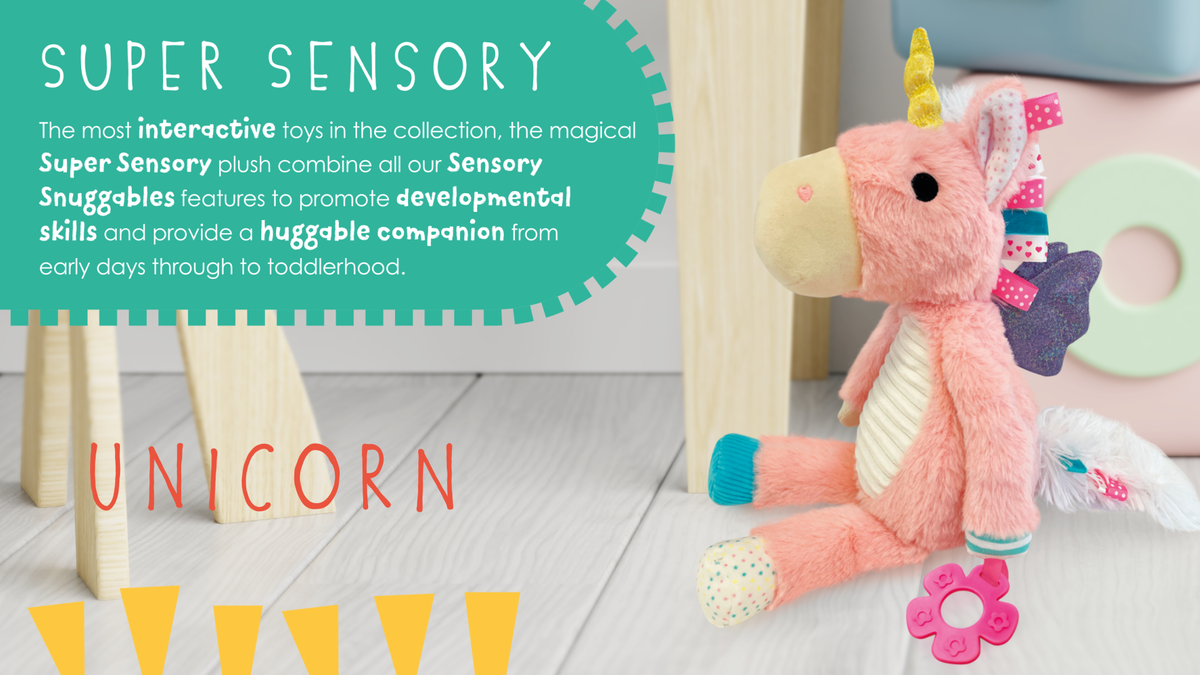 Pink unicorn plush toy with text about Super Sensory toys on a light wooden floor.