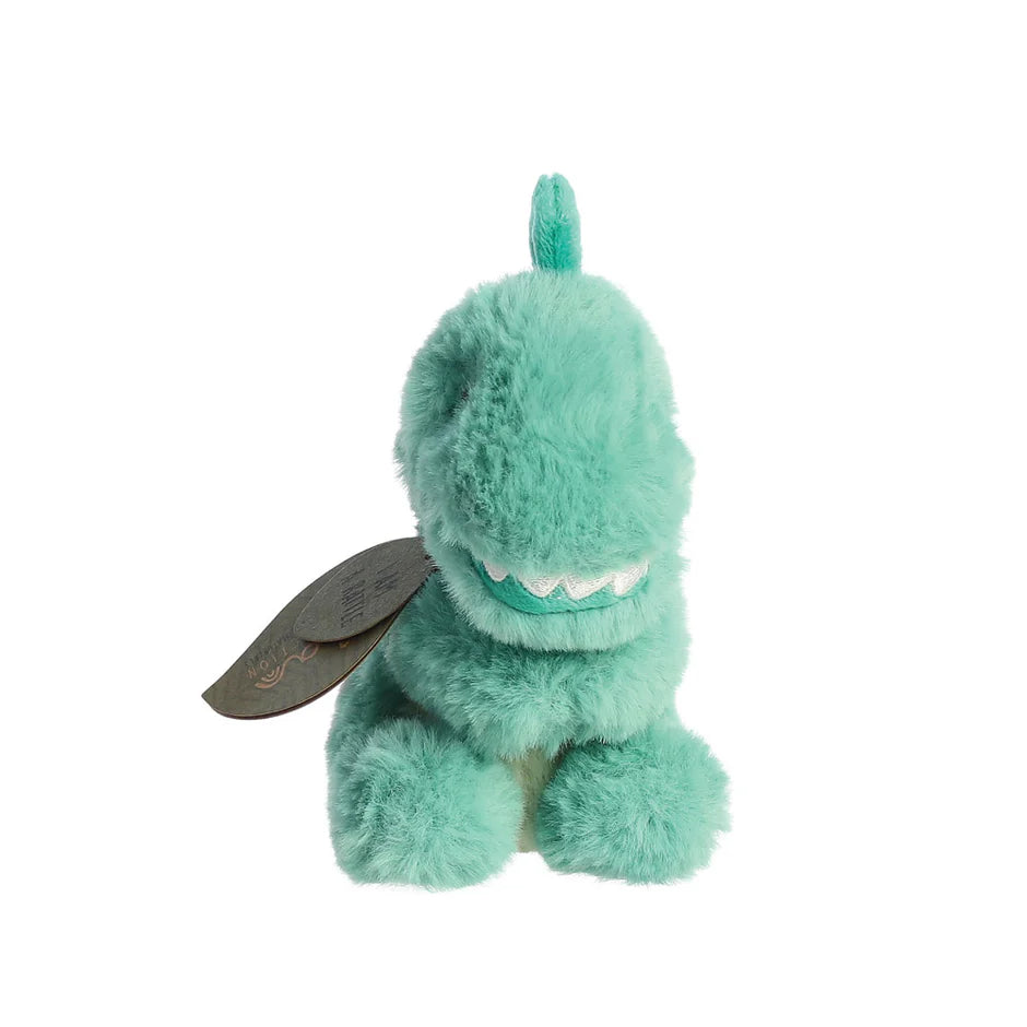 Green plush toy dinosaur baby rattle with a leaf-shaped tag on a white 