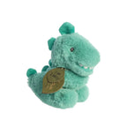 Green plush toy dinosaur baby rattle with a leaf-shaped tag on a white background