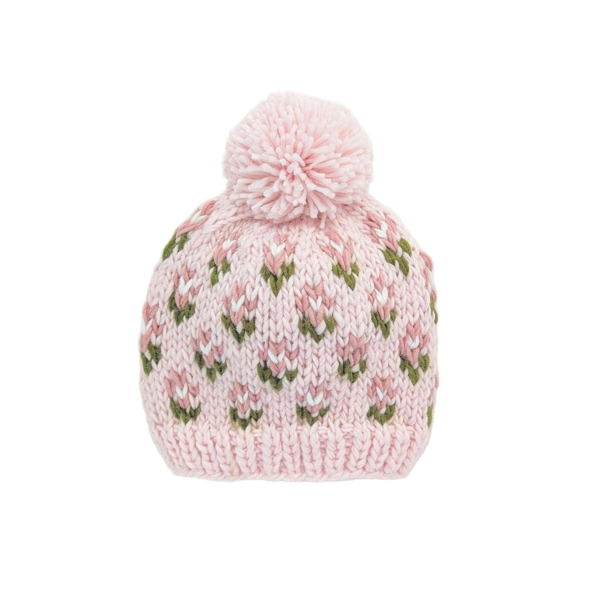 A light pink hand-knit beanie hat with a matching pom-pom on top, featuring a repeating pattern of pink and white tulips with green leaves, shown against a plain white background.
