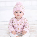 Baby wearing a Huggalugs hand Knitted baby cardigan and hat with pink floral pattern - Aodrababy.co.uk