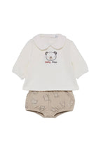 A baby clothing set featuring an off-white long-sleeve top with a Peter Pan collar and a 'Baby Bear' bear graphic, paired with beige patterned bloomers, displayed on a neutral gray background.