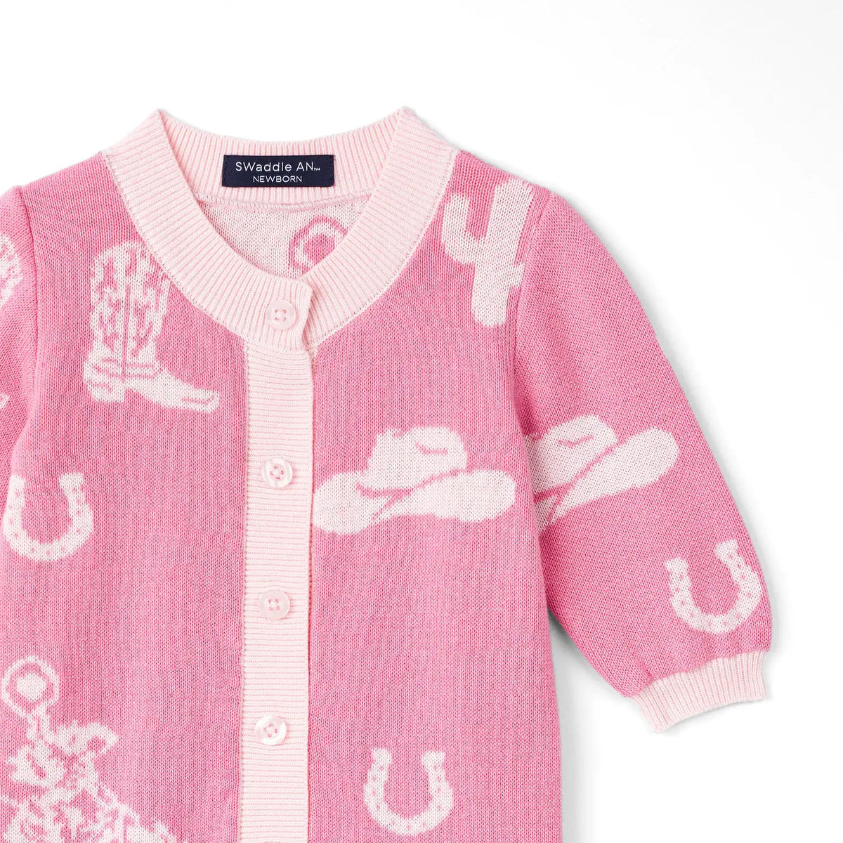 Pink baby romper  with white cowgirl hat, boots and horses patterns on a white background = AdoraBaby.co.uk