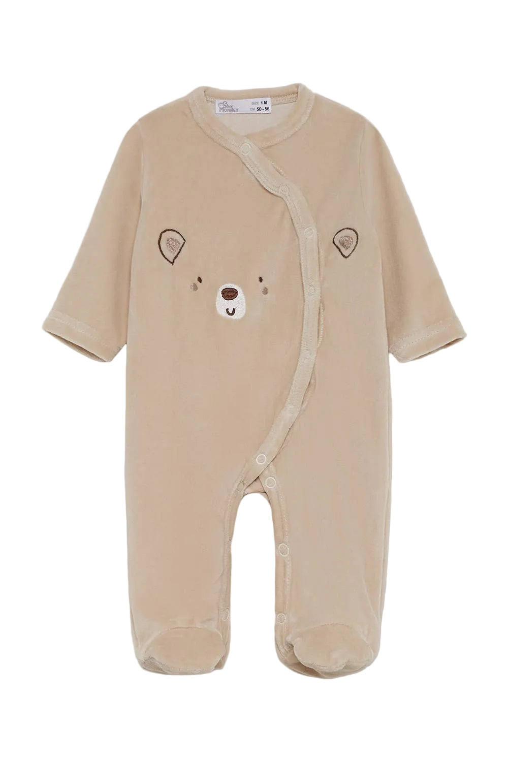 A baby's long-sleeve footed sleeper in a soft beige corduroy fabric, featuring an embroidered bear face on the chest.
