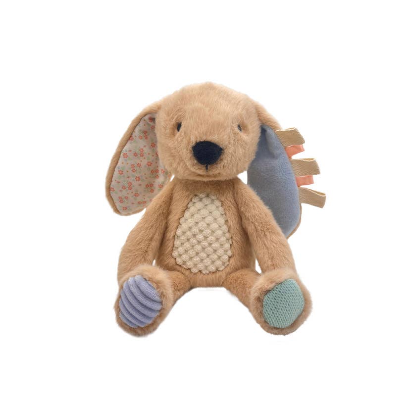 Plush toy rabbit with floral ears on a white background