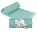 Two light green baby blankets, one rolled and one with a ribbon, on a white background. Adorababy.co.uk