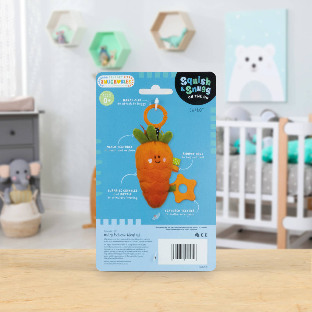 Carrot-shaped toy with packaging on a wooden surface in a nursery setting