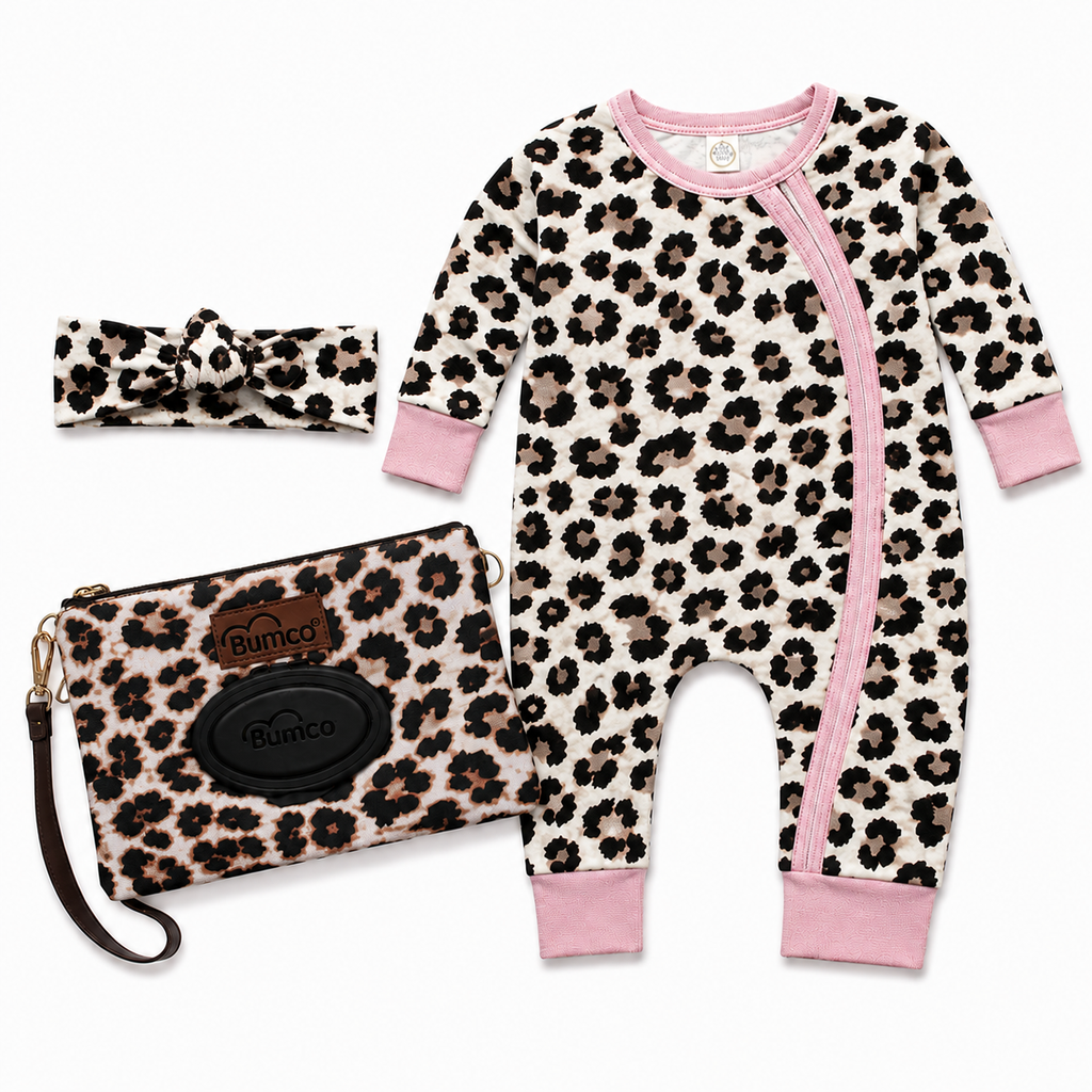 Leopard print baby romper with pink accents, matching headband, and pouch on a white background. | Adorababy.co.uk