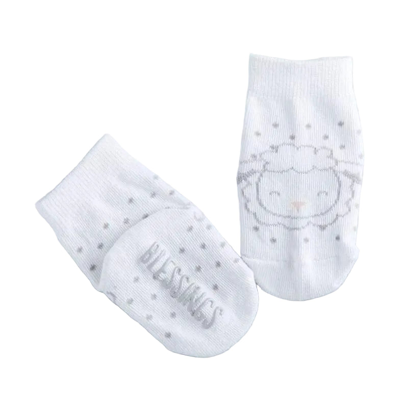 White socks with lamb design and 'Blessings' text on a gray background